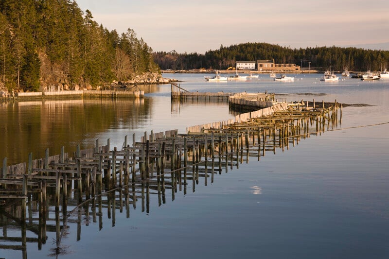 A broken dock stretches into the water.