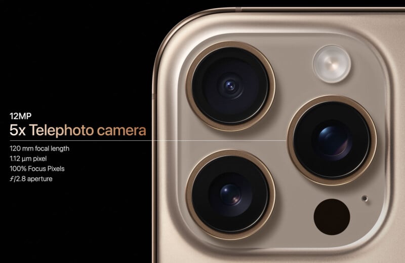 Close-up shot of a smartphone's rear camera module featuring three camera lenses and a flash. Text details one lens: "12 MP 5x Telephoto camera, 120 mm focal length, 1.12 µm pixel, 100% Focus Pixels, f/2.8 aperture" on a black background.